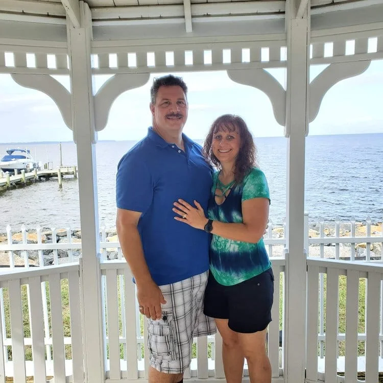 Harvey Betts with his wife on a waterfront gazebo